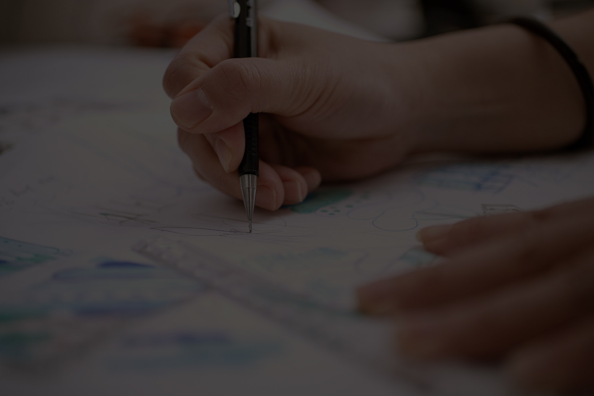 Close up of pen in hand writing on paper