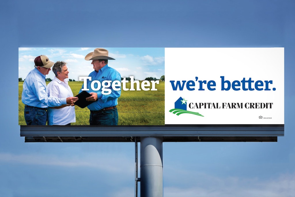 Capital Farm Credit billboard featuring 3 men in a field