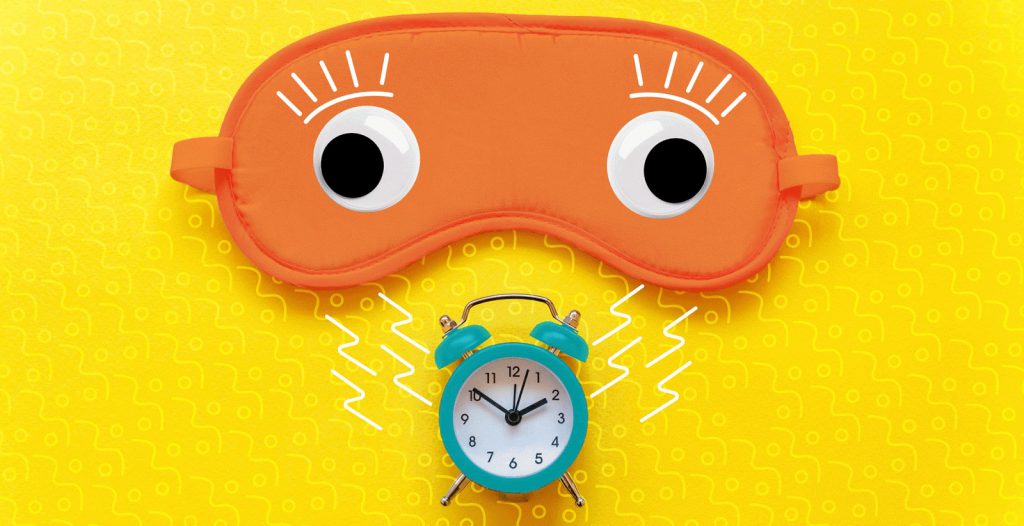 Sleeping mask waking up to an alarm clock