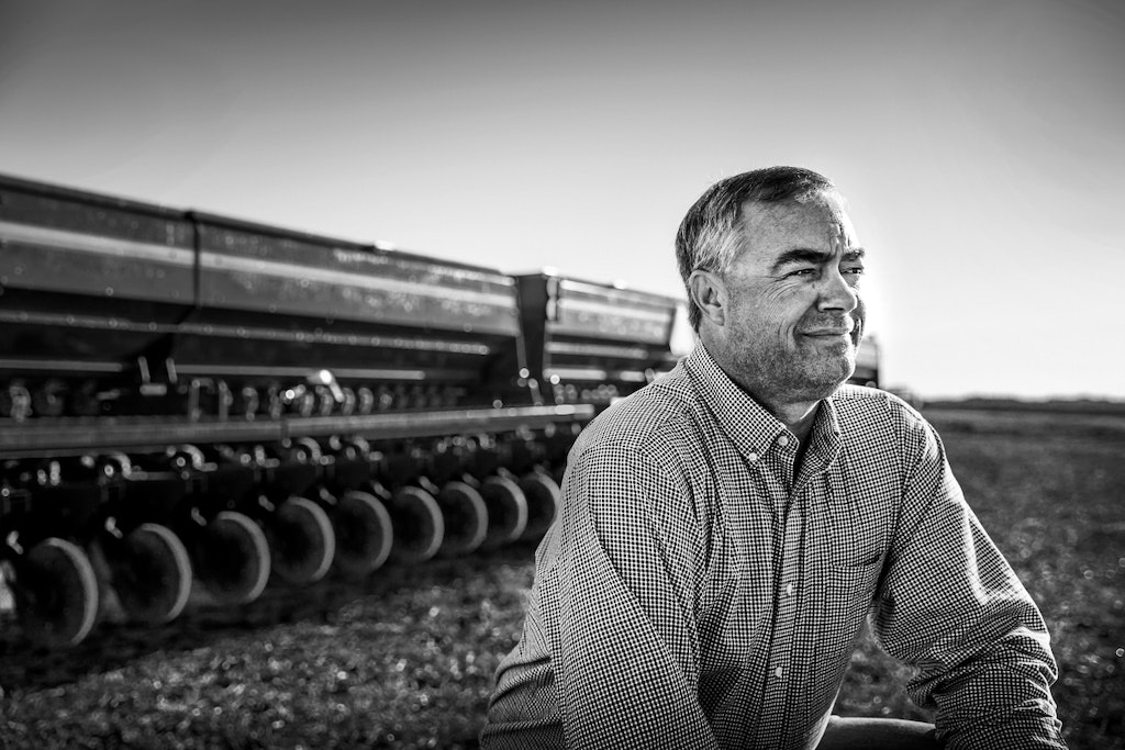 Farmer In Field With Equipment