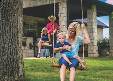 Mother and young child on a swing