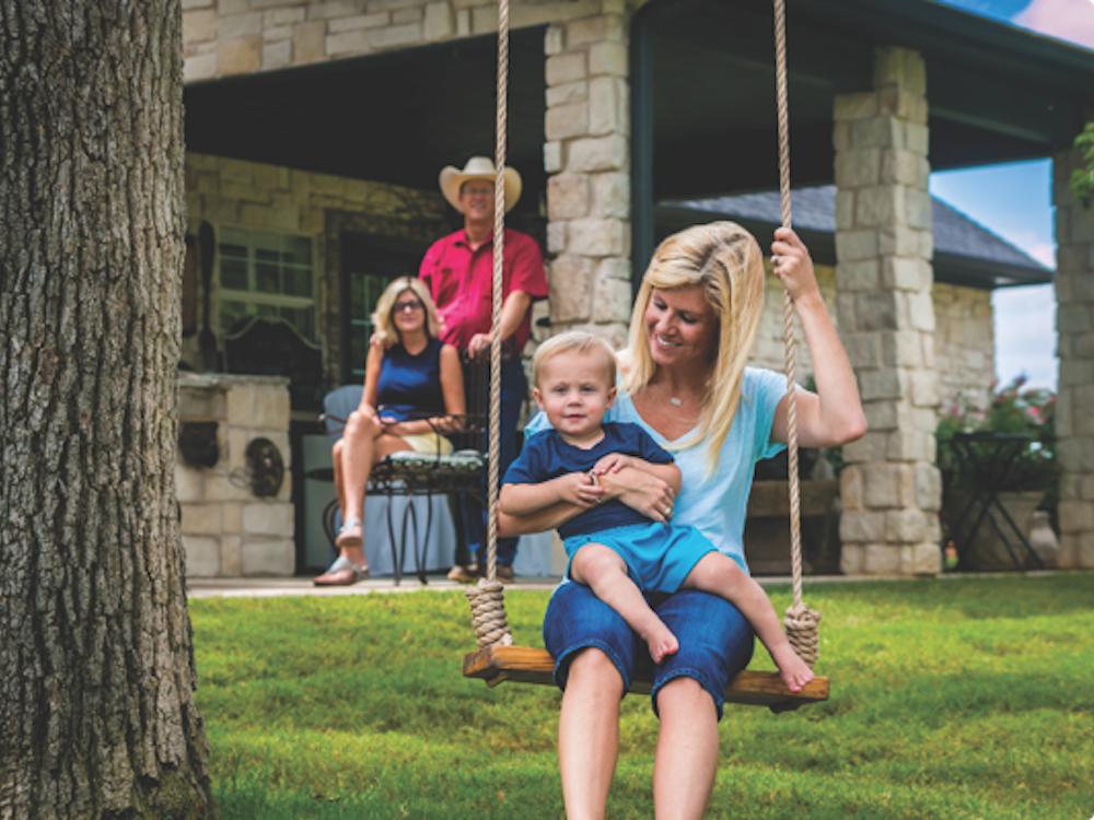 Mother and young child on a swing